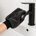 RydaGlove microfibre cleaning mitt wiping a matt black towel ring