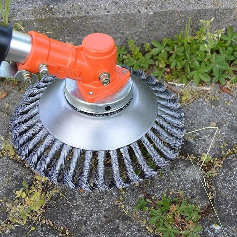 T26 PRO head shown fitted to a strimmer clearing a paved edge - strimmer not included